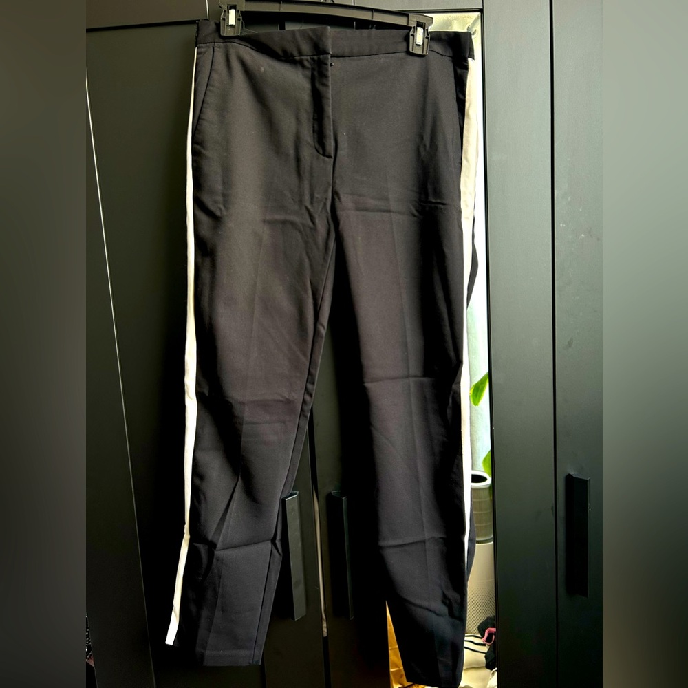 Black ankle length dress pants with a white/grey stripe on the side